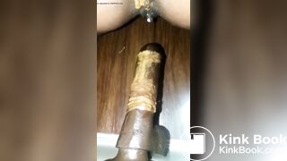 She fucks herself with a dildo and shits