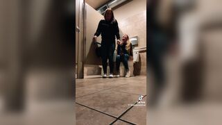 Blonde girl pooping while accompanied by friend