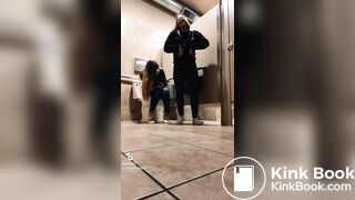 Blonde girl pooping while accompanied by friend