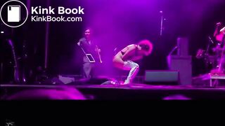 singer pisses on fan on stage.