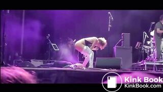 singer pisses on fan on stage.