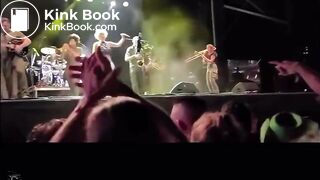 singer pisses on fan on stage.