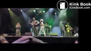singer pisses on fan on stage.