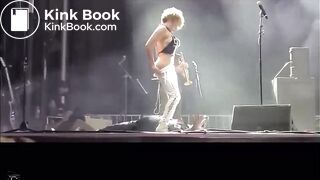 singer pisses on fan on stage.