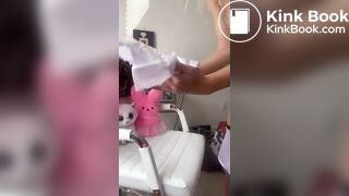 Woman pooping on diaper placed on chair