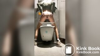 Pooping girl at the toilet