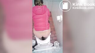woman poop in toilet overhead view