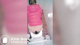 woman poop in toilet overhead view