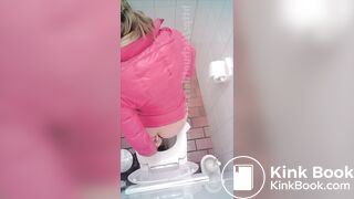 woman poop in toilet overhead view