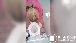 woman poop in toilet overhead view