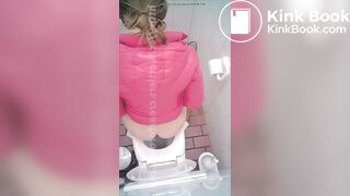 woman poop in toilet overhead view