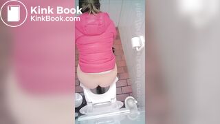 woman poop in toilet overhead view