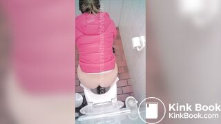 woman poop in toilet overhead view
