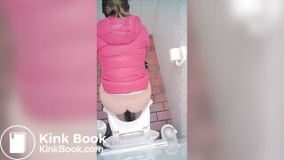 woman poop in toilet overhead view