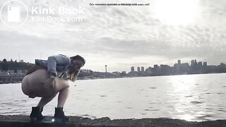girl shitting in a lake shore