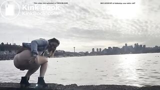 girl shitting in a lake shore