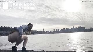 girl shitting in a lake shore