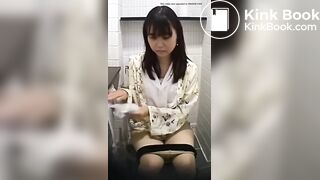 Pretty Asian girl pooping on the toilet