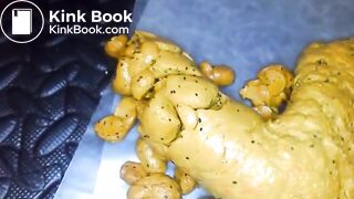 Yellow poo with seeds..