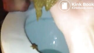 Fingering her ass while she's pooping