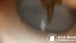 Fingering her ass while she's pooping