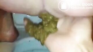 Fingering her ass while she's pooping