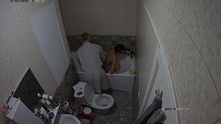 a man is helping this woman to make a fantastic pear