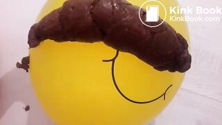 Girl shitting on balloon