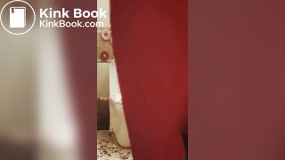 Girl in a red dress pissing at a party