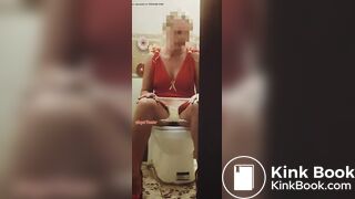 Girl in a red dress pissing at a party