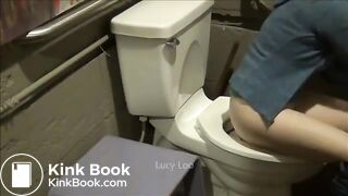 Redhead girl uses toilet