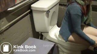 Redhead girl uses toilet