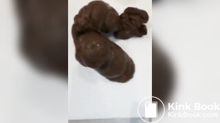 Pink haired teen pushes out big turd