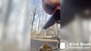 Girl shits off the side of a park bench