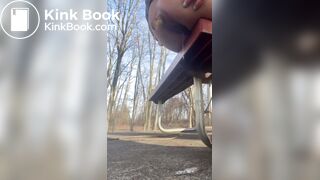 Girl shits off the side of a park bench