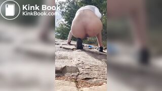 Girl shits outdoors on a hiking trip