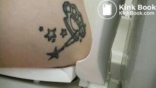 Tattooed girl toilet explosion