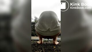 Female is diarrhea in the street