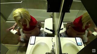 2 women pooping with reflections in a mirror
