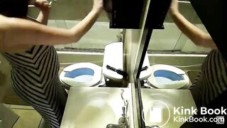 2 women pooping with reflections in a mirror