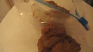 creamy poop in a white plastic bag