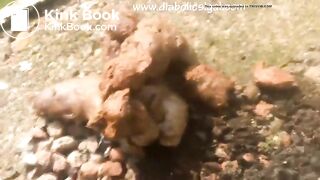 Redhead poops outdoors..