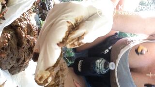 A milf poops in forest and inspects his shit