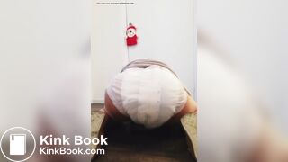 Girl sits and squishes in her poopy diaper