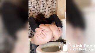 Female poop on toilet