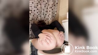 Female poop on toilet