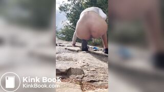 Cute girl outdoor shitting on the rocks