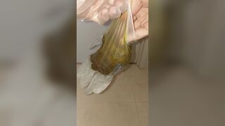 japanese girl put hand in pooped plastic glove 1