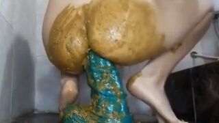 Messy anal scat play with a huge toy
