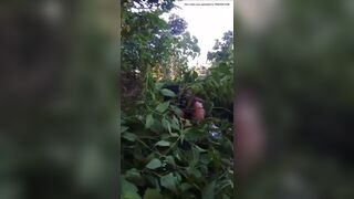 Girl pooping in bush